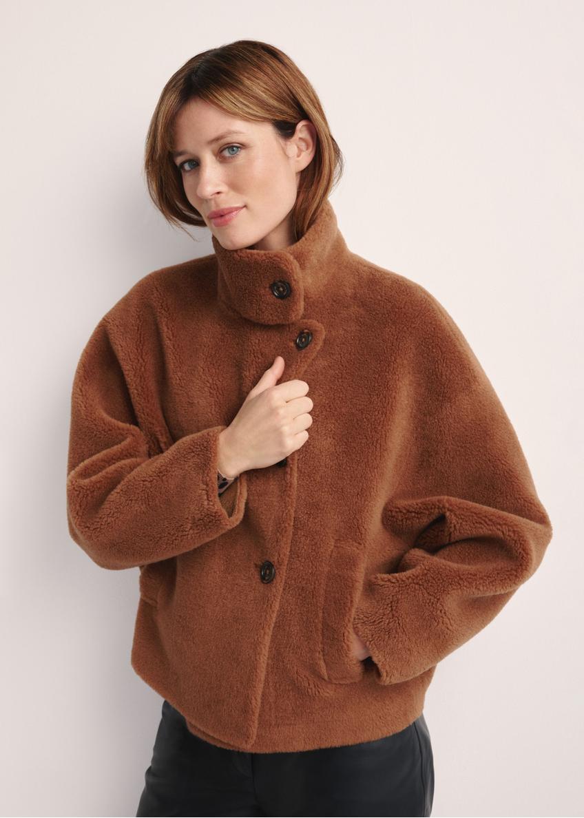Brown woolen women's fur coat FUTDW-0033-1D(Z26), front view of the product on the model. Half of the silhouette visible.