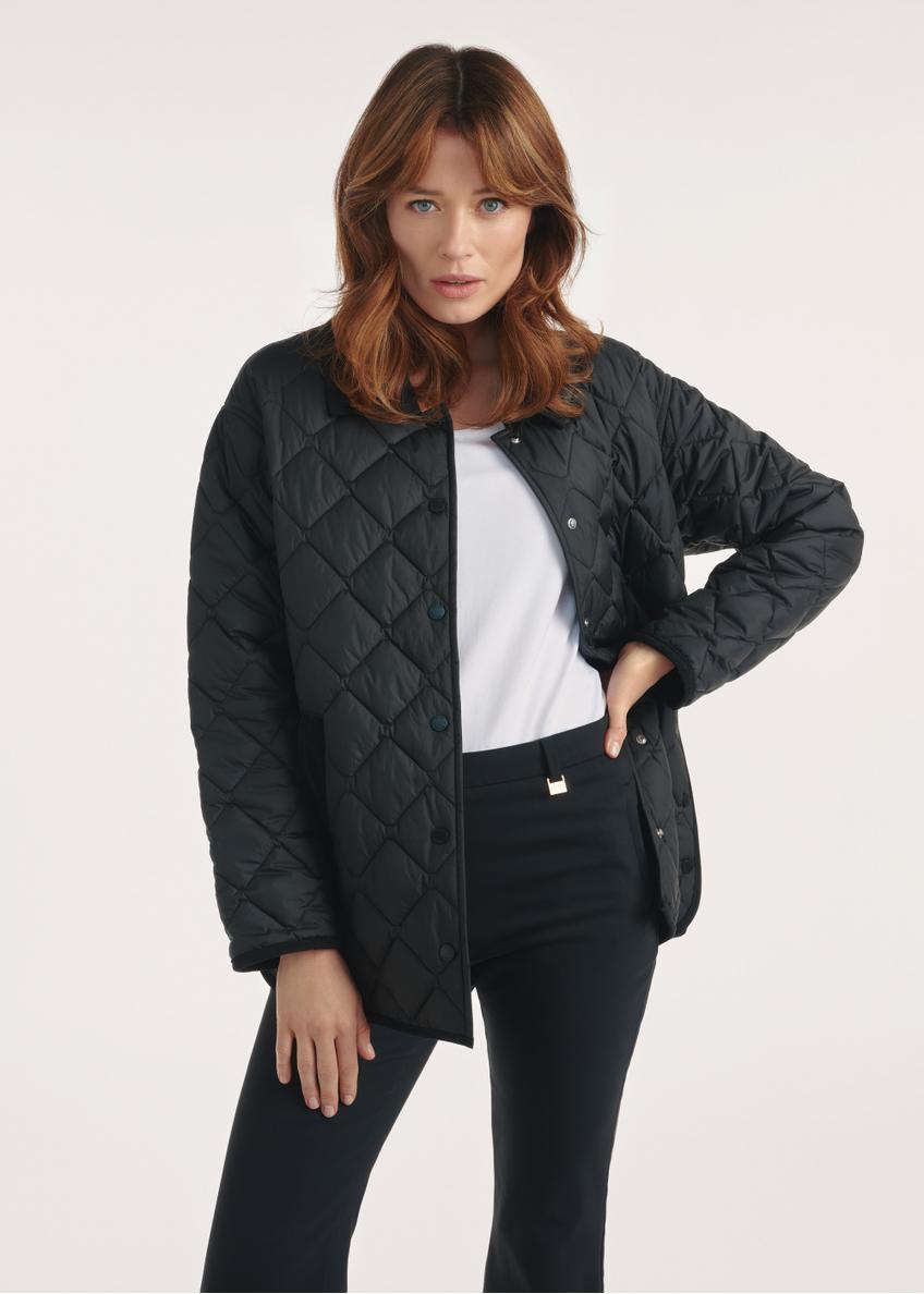 Black women's quilted jacket with hood KURDT-0588-99(Z25), front view of the product on the model, half of the silhouette visible.