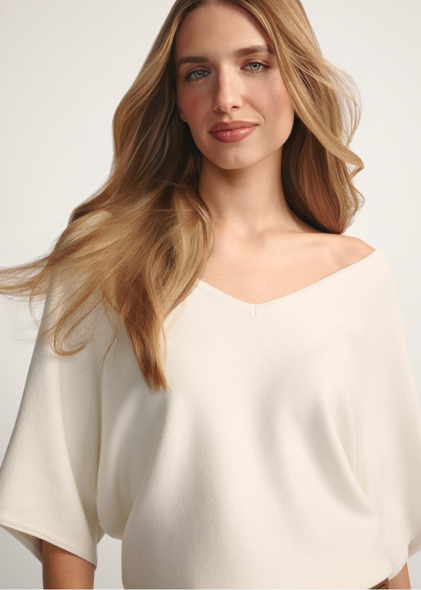 White women's blouse BLUDT-0201-0B(W26), close-up of the product from the front on the model.