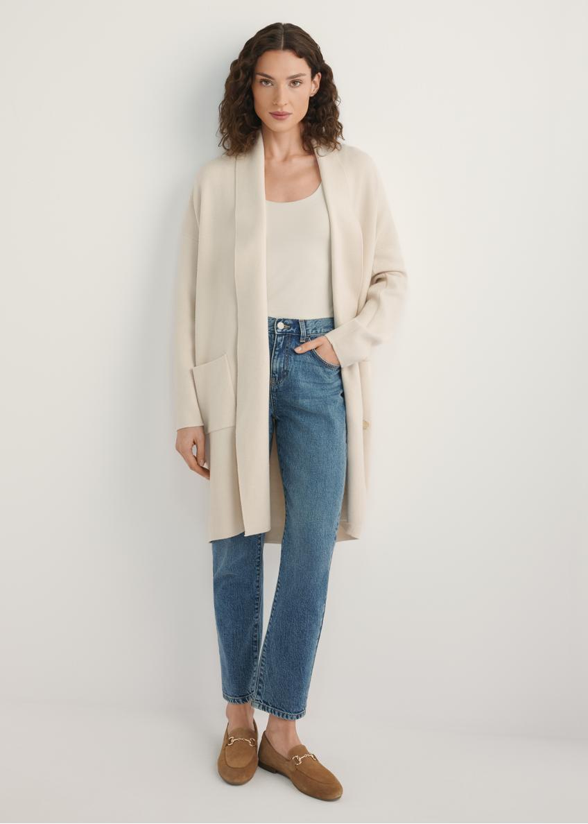 Beige women's cardigan KARDT-0041-1A(W26), front view of the product on the model. Half of the silhouette visible.