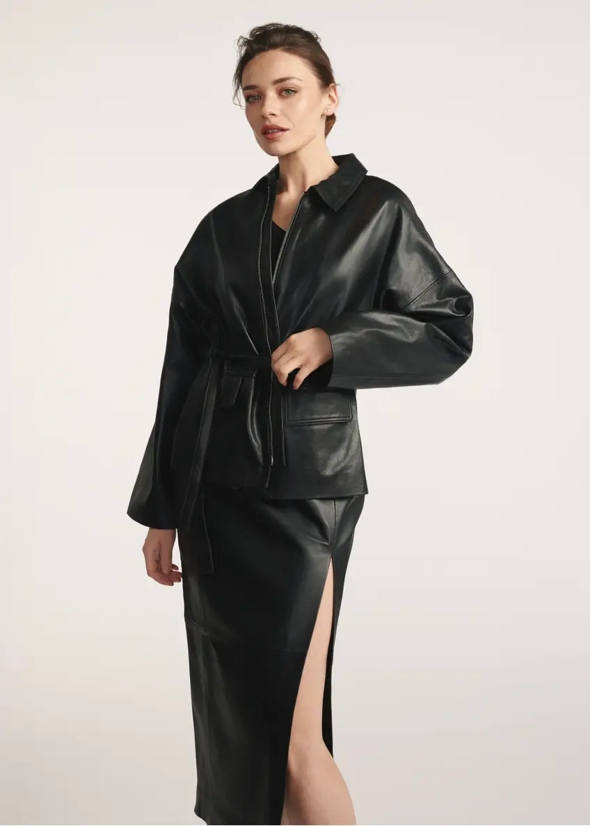 Black women's leather jacket with ties KURDS-0547-2861(Z25), front view of the product on the model, half of the silhouette visible.