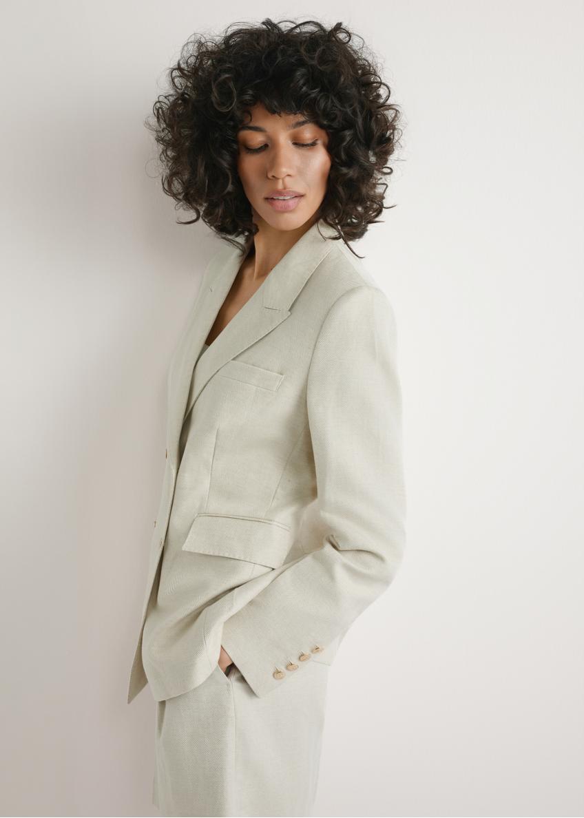 Women's light beige linen blazer ZAKDT-0049-1A(W26), front view of the product on the model. Half of the silhouette visible.