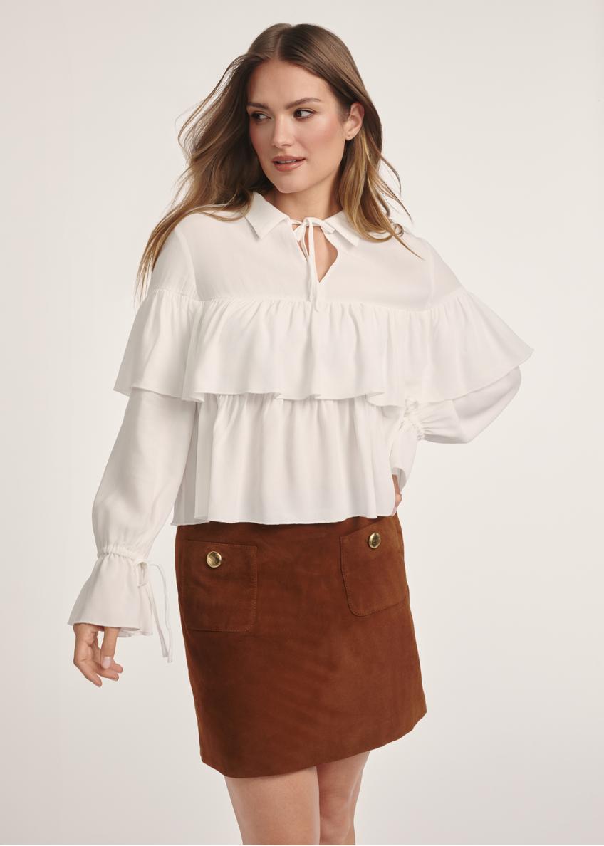 Women's white blouse with frills BLUDT-0198-12(Z25), front view of the product on the model. Half of the silhouette visible.