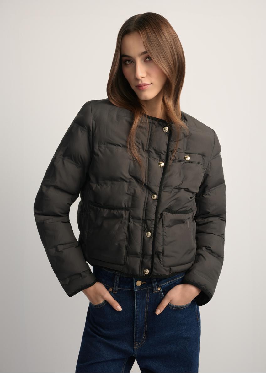 Black women's short jacket KURDT-0621-99(W26), front view of the product on the model. Half of the silhouette visible.