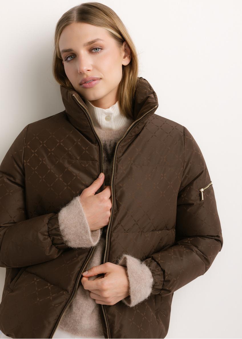 Women's dark brown monogram jacket with stand-up collar KURDT-0694-1I(Z26), front view of the product on a model. Half of the silhouette visible.