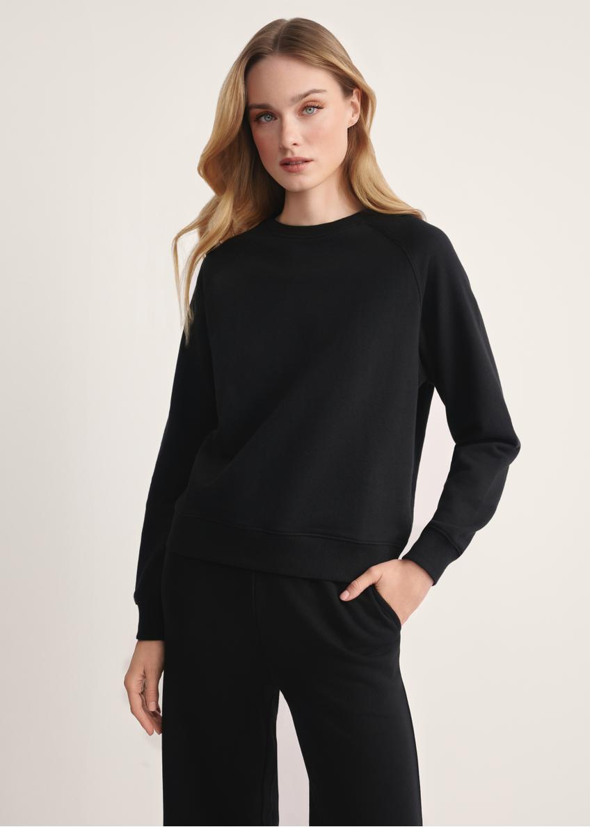 Black women's sweatshirt BLZDT-0114-99(Z25), product visible from the front on the model, half of the silhouette visible.