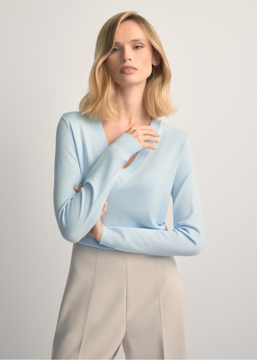 Light blue V-neck sweater SWEDT-0201-7A(W26) - front view of the product, on a model, against a light background. Half of the silhouette visible.