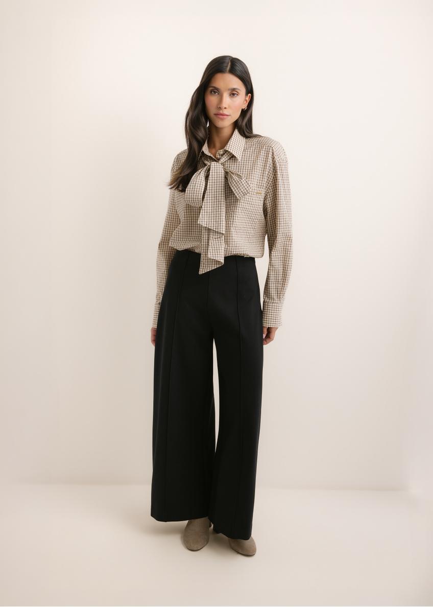 Black women's wide leg trousers SPODT-0130-99(Z26), front view of the product on the model. The entire silhouette is visible.